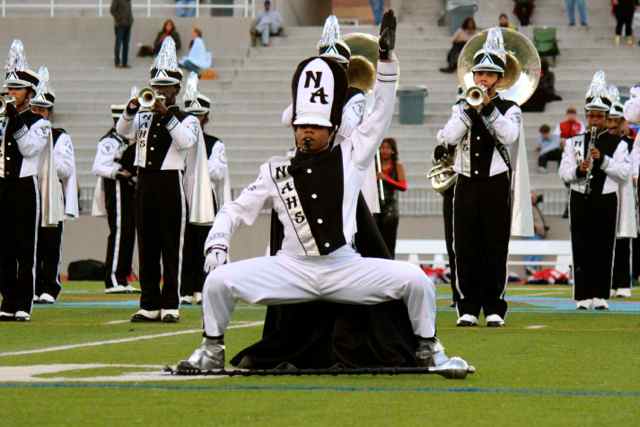 Above, a North Atlanta warrior leads a performance at halftime. 