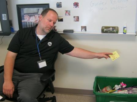 Michael Hutchings,  Environmental Sciences teacher, does his part for the recycling cause. 
