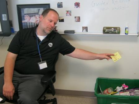 Michael Hutchings, Environmental Sciences teacher, does his part for the recycling cause.
