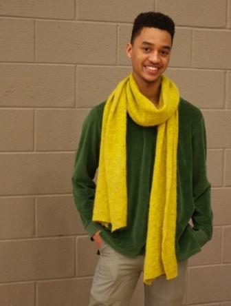 Elijah Williams rocks the sweater with bold bright scarf combination. 