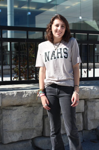 Sophomore Katie Waken sports a NAHS t shirt outside of the gymnasium. 