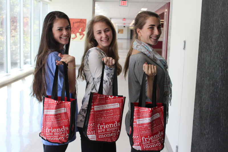 (Left to Right) Juliet Eden (11), Lark Izenson (10) and Quincy Staley (12) all sport their LuluLemon red bags on a daily basis. 