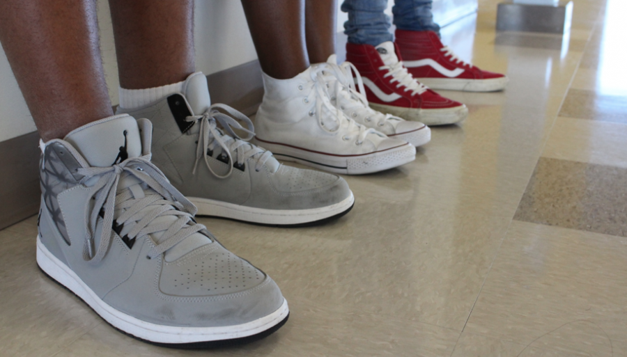 Students sport different popular shoe brands (left to right) such as Jordans, Converses, and Vans. 