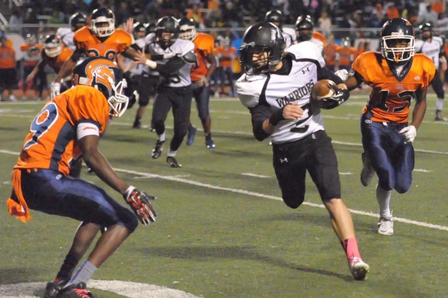 Senior receiver Josh Johnston scrambles for yardage against North Springs. 