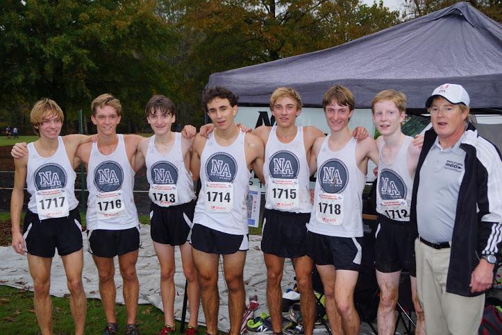 Running Warriors celebrate the best state meet finish in school history (11th) in Carrollton on Nov. 7. L to R: Matthew Self, John Self, Mac Bloodworth, Nicholas Durham, Jackson Pearce, Jack Tribou, Matthew Aspinwall and Coach George Sanderlin.