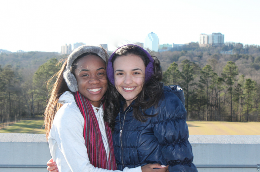 Seniors Taylor McIver and Paige Overmyer (left to right) bundle up for the cold weather as the temperature begins to drop in metro Atlanta. 
