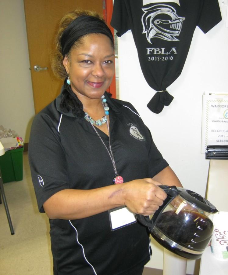 Warrior Store manager Avis Eichelberger pours up another cup of joe for the North Atlanta Coffee Club. 