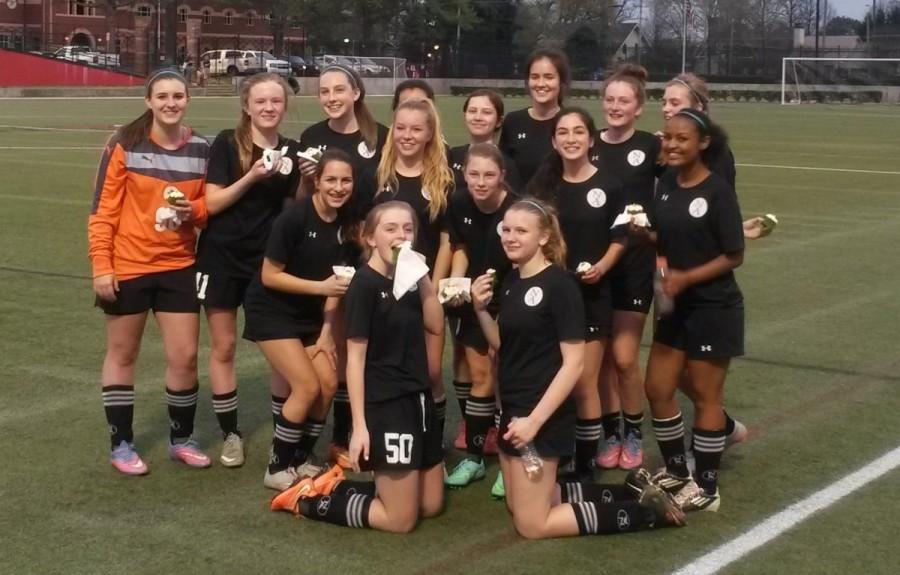 The North Atlanta JV Girls Soccer team exalts after a 3-0 win over Woodward. 