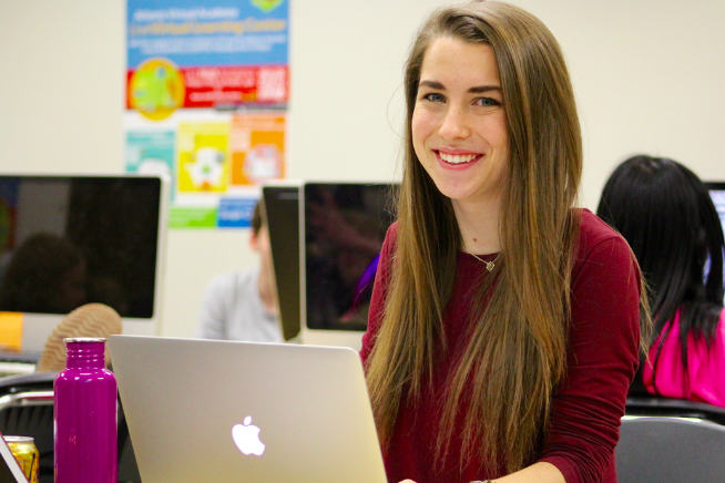 Senior editor Quincy Staley commands the yearbook staff to produce the best book they can. 