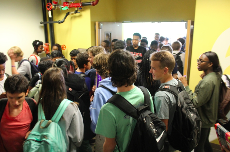 Students+exist+in+close+proximity+while+transferring+between+classes+in+the+stairwells.+