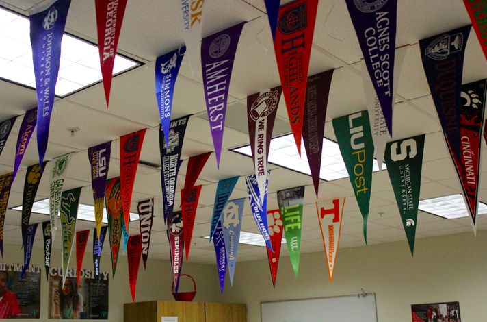 Ms. Bush has covered her room with college propaganda to encourage students to apply for a higher education. 