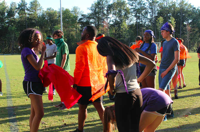 Warriors are decked out in bandanas, capes, and their team colors as they prepare to compete int he Warrior Games. 