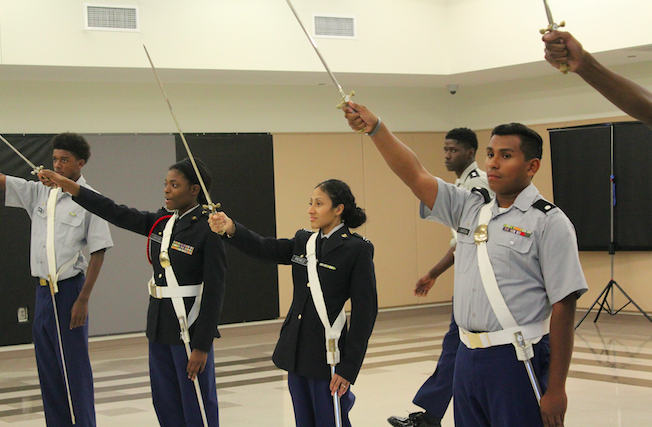 Students in the JROTC program practice in uniform during their class. 