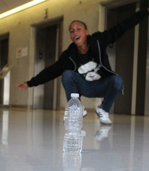 Student Chandler Binder continuously carries a water bottle to practices flipping skills. 