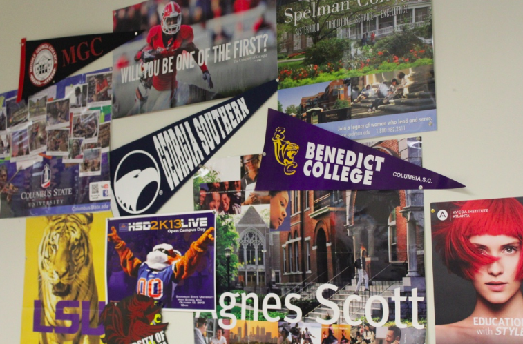 Ms. Bushs walls are covered with college decorations to encourage early applications. 