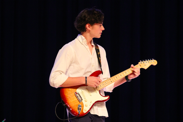 Band member Bradley Reeves performs with the rest of his band during the North Star talent show. 