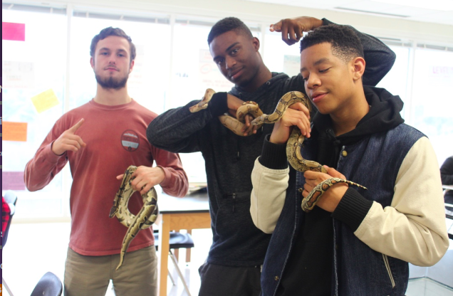 Students+get+to+handle+snakes+during+their+classes+to+learn+about+the+animals.+