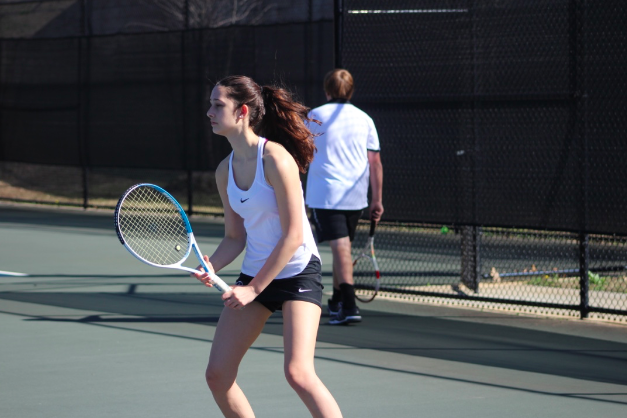 Sophomore Lila Ward awakes the serve by the opposing team. 