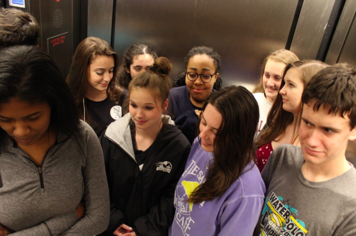 Elevators generally are packed full of students who hardly talk. 