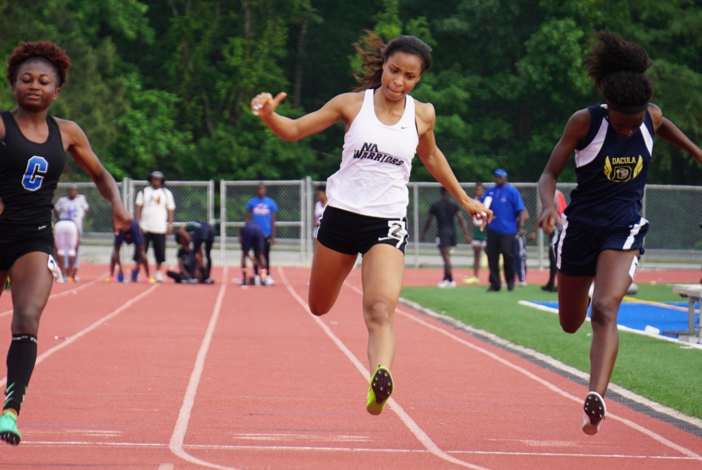 Junior sprinter Kyla Lestagez competes hard at recent North Atlanta-hosted regional meet. 