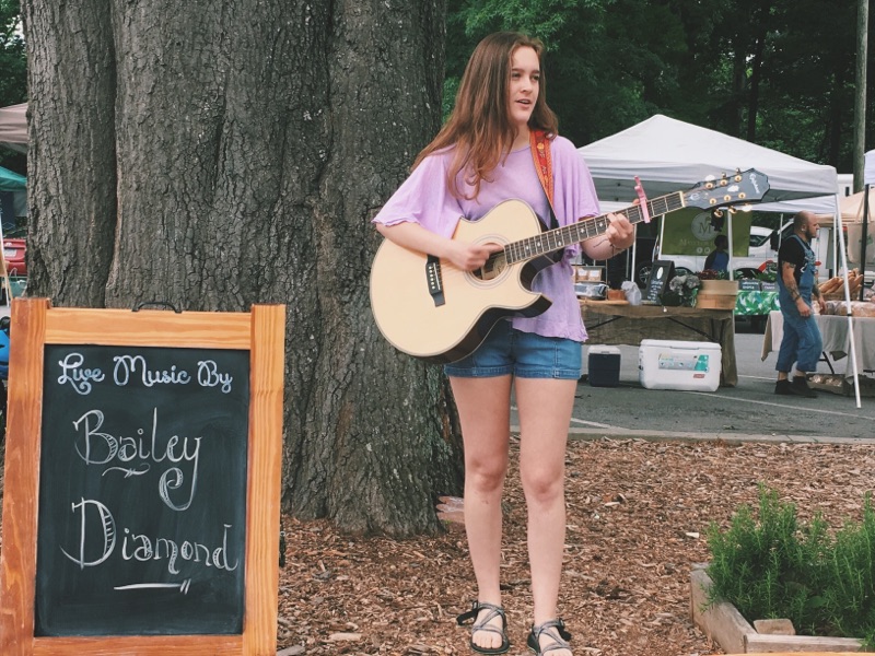 Sophomore Bailey Diamond is a consistent acoustic feature at the Buckhead’s Peachtree Road Farmers Market. 
