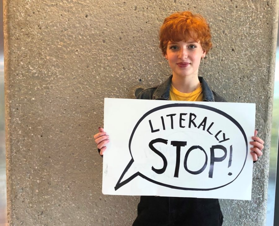 Writer Rhiann Ashmore literally holds up a sign asking for a literal cessation of use of the word “literally.”
