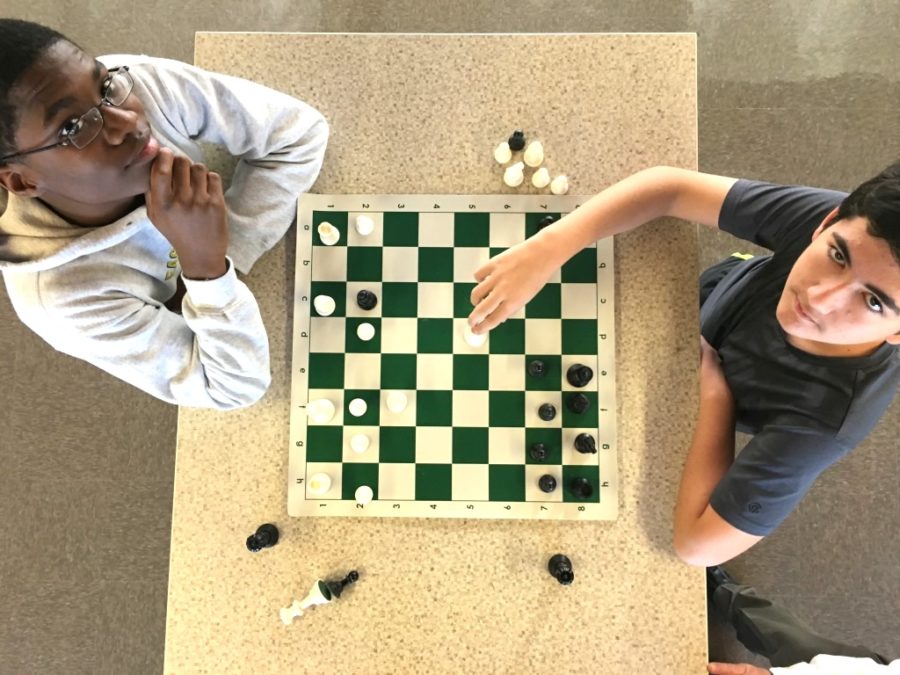 Every+Monday+morning%2C+Warriors+wage+battle+with+clashing+knights%2C+kings%2C+rooks%2C+bishops+and+pawns+during+meetings+of+the+North+Atlanta+chess+club.+Sophomore+Harrison+Head+and+freshman+Alan+Spektor+go+head+to+head.+