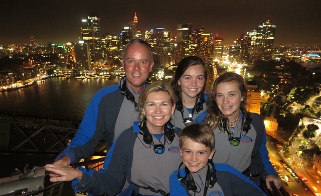 Aussie Panorama: Along with members of her family, sophomore Anna Pannell (back center) enjoys the spectacular nighttime view of Sydney, Australia, from high atop the Sydney Harbor Bridge. 
