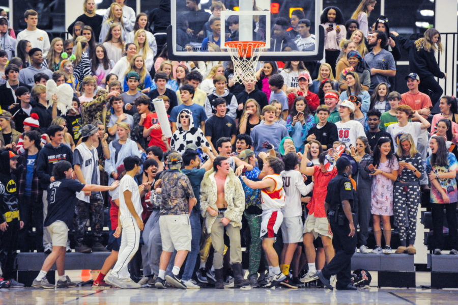 Making Some Noise: Members of the Northside Noises -- in full zany mode -- lead the North Atlanta student section during a recent Warrior basketball game. 