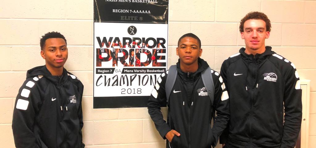 Push To The Final Four: The Warriors are on an amazing run and a win against Heritage could get them to the Final Four. Shown left to right are junior Messiah Thompson and seniors Desmond Thomas and Andrew Stimpson.
