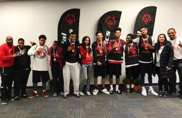 Golden Effort: North Atlanta basketball squad members along with faculty members and volunteers bask in their the team’s earned gold-medal glory after a Special Olympics competition in Cartersville in January. 
