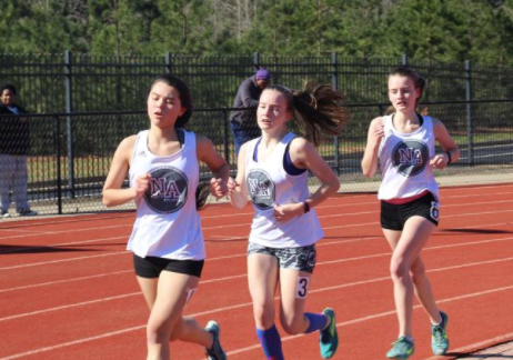 Track athletes junior Sarah Pearl, Aubrey and sophomores Sydney Miller push this season for the Warrior Track and Field team. 