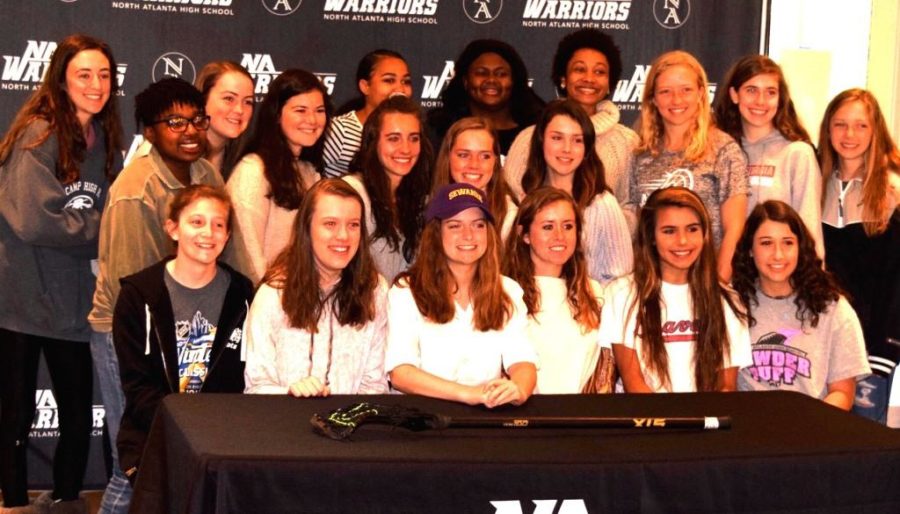 Future+Tiger%3A+Senior+Anna+Day%2C+who+has+signed+to+play+lacrosse+for+the+University+of+the+South%2C+is+one+of+many+Warrior+athletes+who+will+play+their+chosen+sport+in+college.+On+Signing+Day+on+April+11%2C+Day+gathered+with+her+Warrior+varsity+girls+lacrosse+teammates.+%0A