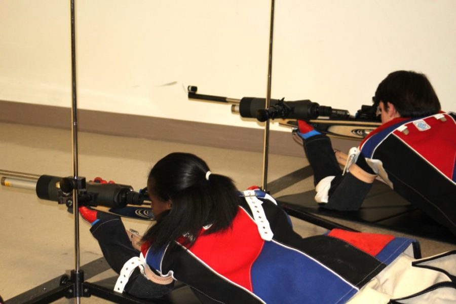 Big Shots: Rifle team members Amaya Bacon and Sparks Highsmith take aim at the target during a recent competition. 