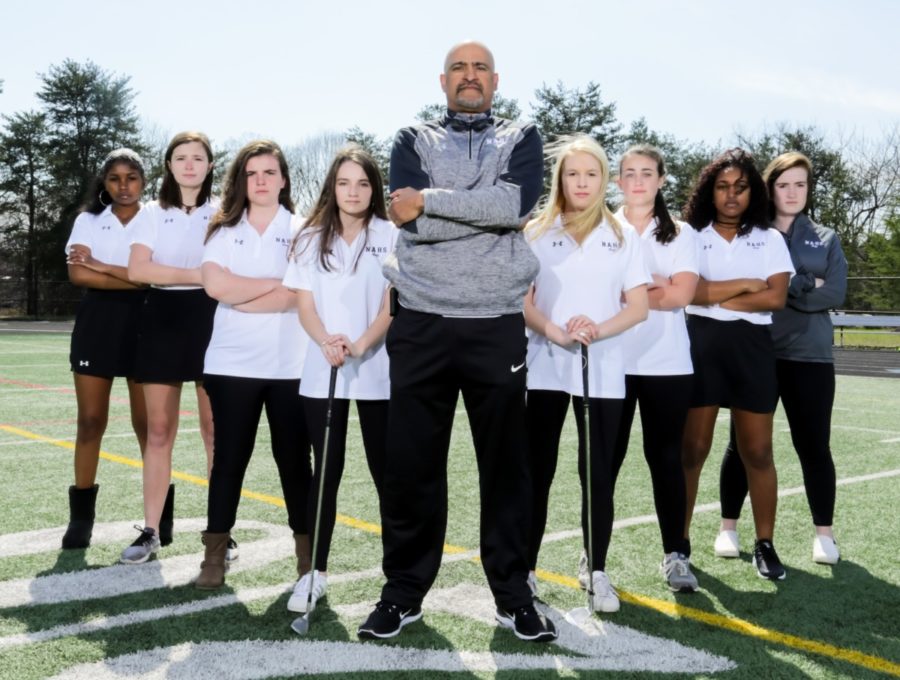 Going for the Greens: The Warrior girls golf team is swinging toward a competitive 2018 season. The team here is shown with Coach Kerry Sarden.  