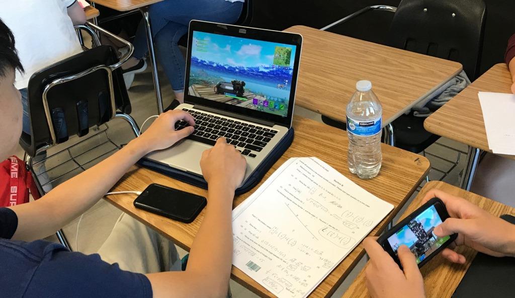 Gamers Galore: North Atlanta students Henson Hugh and Luca Kurtz take advantage of some down time to catch up on playing Fortnite, the newest video game craze.