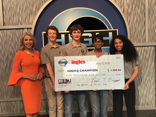 Brain Game: Members of the champion North Atlanta “High Q” team members pose with show host Katie Walls, a WSB-TV meteorologist. Teams members are Quint Gfroerer, Jake Churchill, Ishaan Ghosh and Devon Gates. 