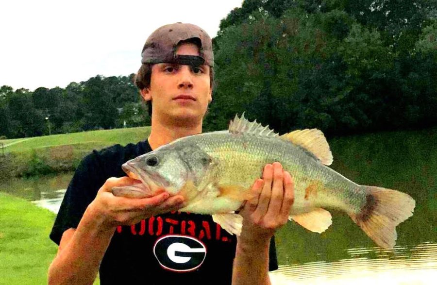 Catch A Break: Junior Jack Kiefer takes the oppor-tuna-ty over the summer to go fishing at the NAHS lake.