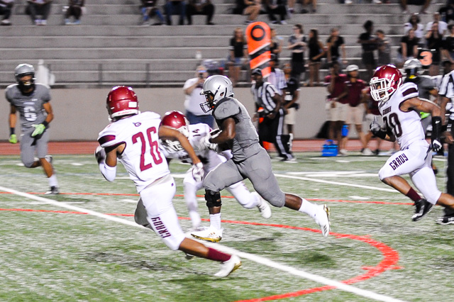 Senior running back Christian Tanks eludes Grady defenders as he creates room to run during the Warriors’ convincing 20 to 7 win.