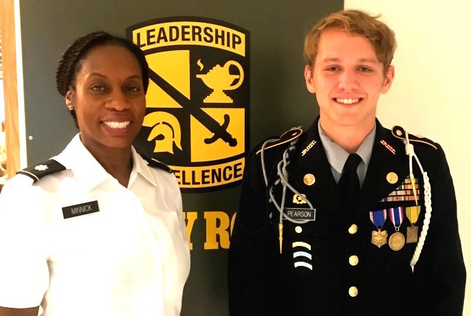 Battle+On%3A+Senior+and+Battalion+Commander+Fraser+Pearson+stands+with+JROTC+Director+Lt.+Col+Lynnette+Minnick+after+being+honored+with+the+National+Legion+of+Valor+Bronze+Cross+Award.