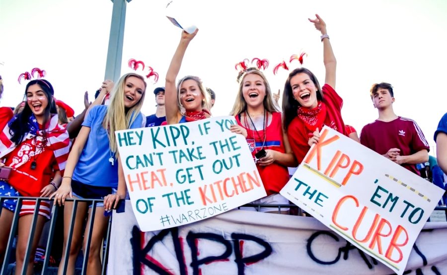 Fired Up: A rowdy student section was on hand for the Aug. 31 North Atlanta victory over KIPP Atlanta. Shown here -- for the fire night theme -- are seniors Jereme Weiner, Morgan Smith, Hanna Shaw, Catherine Johnson, Addie Decker and Gamble Cleary.  
