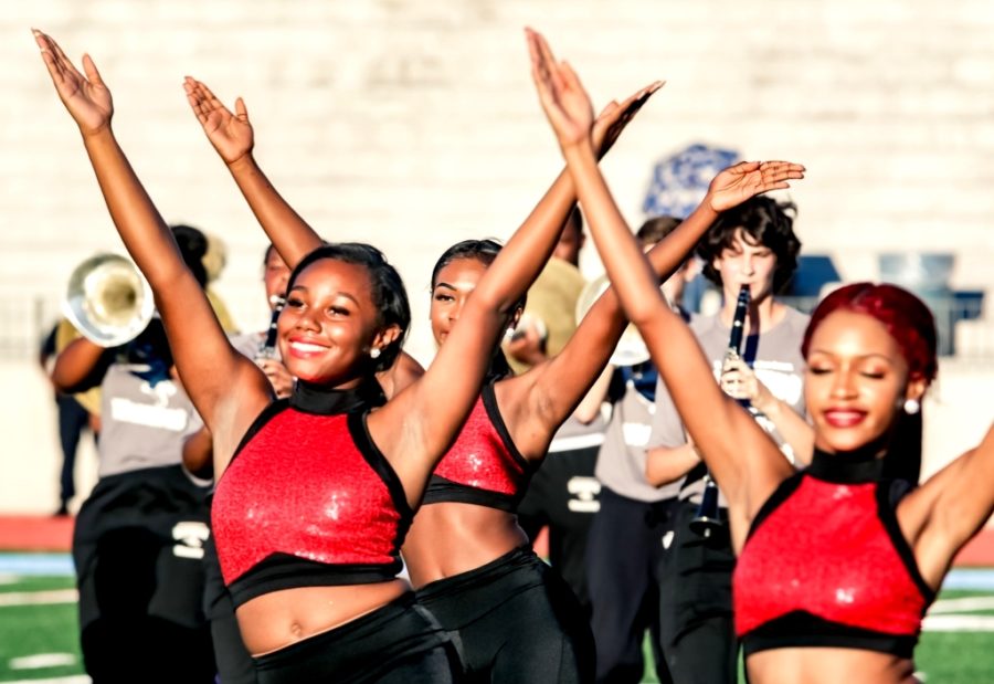 Right Moves: To make the selective Silver Stars troupe, it takes poise, high energy and plenty of dancing excellence. Sophomore Nia Cainion and senior Alayna Smoot show they have what it takes during halftime of the Aug. 31 North Atlanta game. 