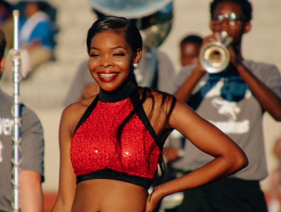 Ready to Shine: Senior Madisyn Porter flashes a winning smile during the Silver Star routine held halftime during the North Atlanta-KIPP Atlanta game. 