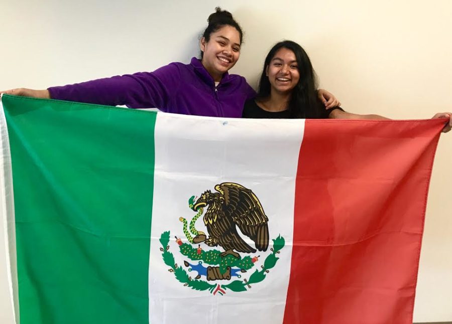 Fiesta of Pride: Juniors Gabriela Oliveros and Maria Niño celebrate Hispanic culture through its flags and music during the Hispanic Heritage Month. 