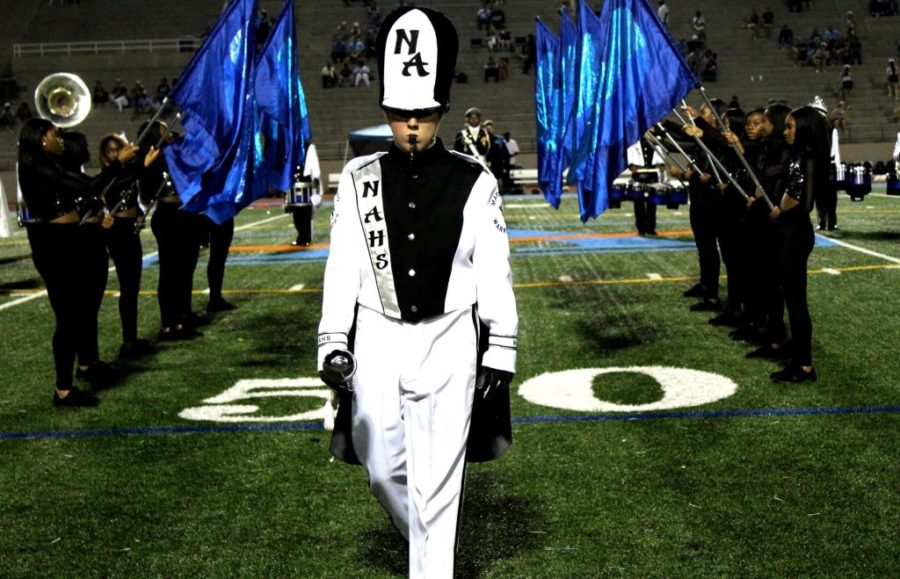 March Up to the Top: Senior drum major Emmett Galloway, along with the rest of the marching band, celebrate their win of a third rank in the National High Stepping High School Marching Band Competition finals. 