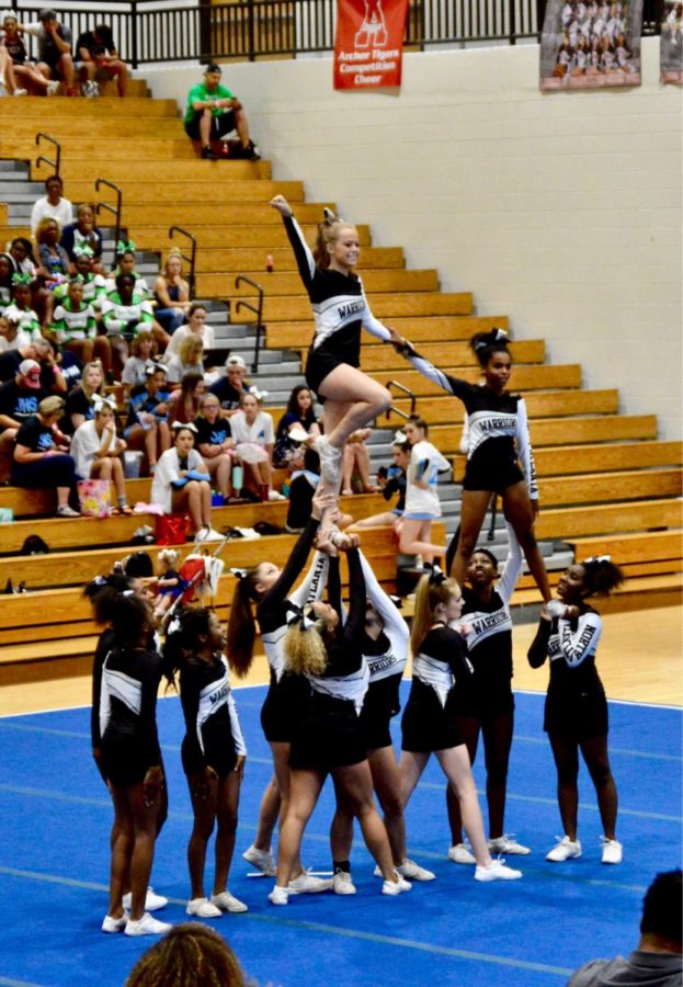 Ready, Set, CHEER: North Atlantas competition cheer squad shows off their moves as a part of their dance routine. 