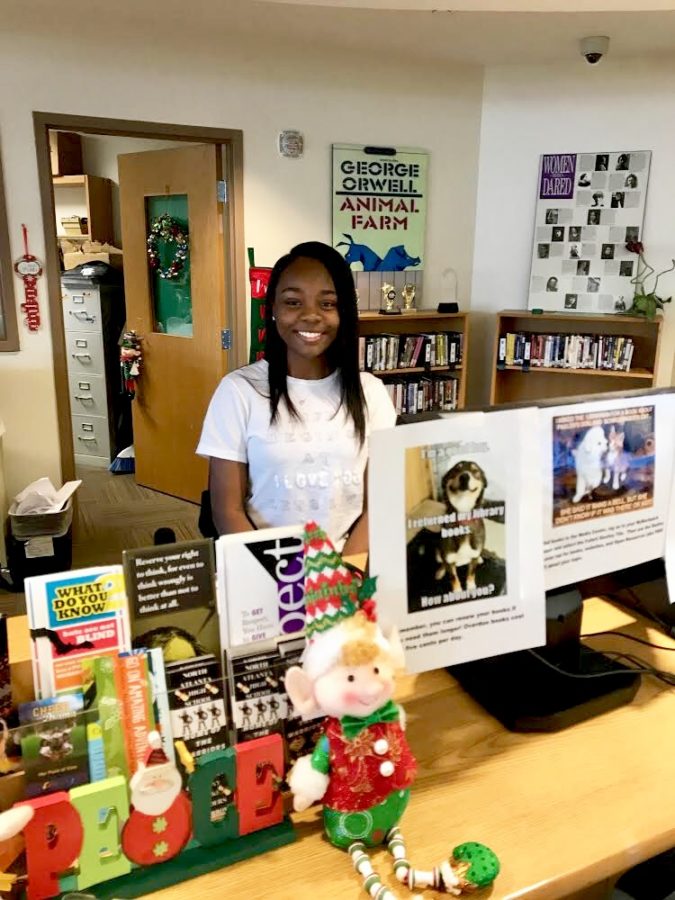 Library Mice: Senior Ashley Foster volunteers at the media center regularly by checking in and out books, sorting through the papers, helping other students, sorting through books, and managing various other tasks. 