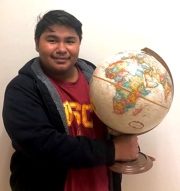 Its A Small World After All: Junior Javier Manzanarez shows his excitement for all of the students participating in the 2019 study abroad programs. 