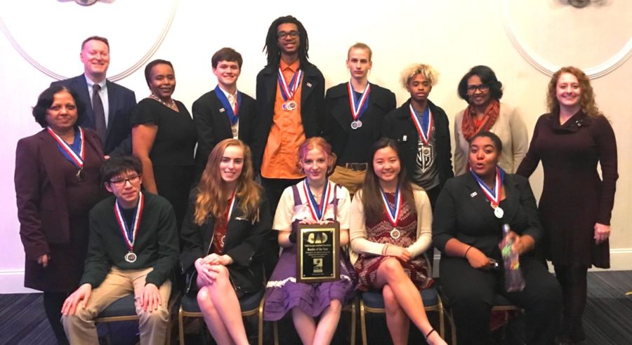 Academic Achievers: The Academic Decathalon team gathers together after winning the state-level Decathalon competition. 