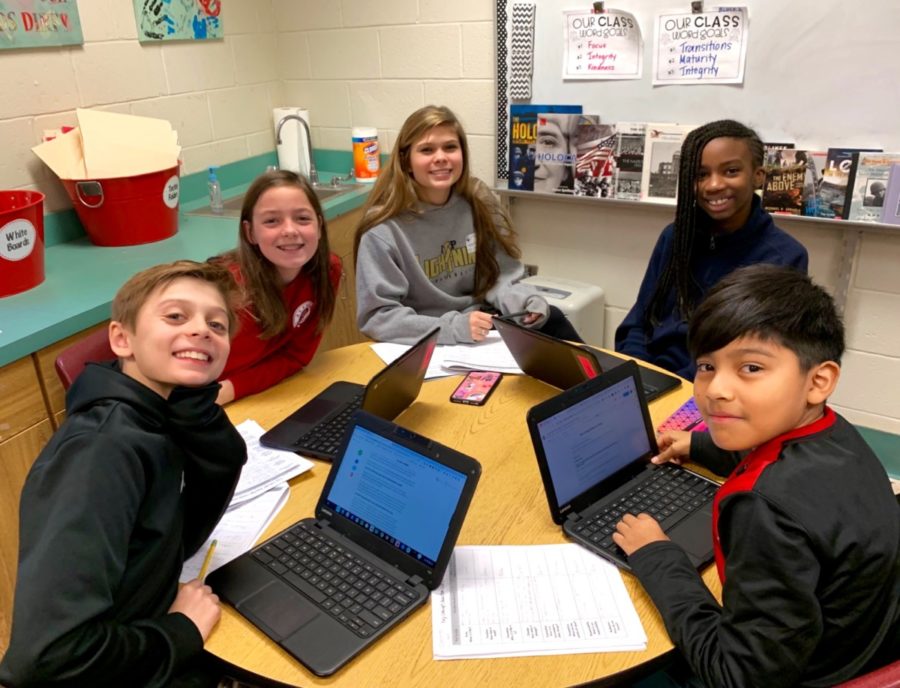 Aid for Tots: North Atlanta students help out elementary school kids at Jackson to help with their PYP exhibitions.